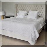 F46. Upholstered king bed with powered adjustable mattress. 60”h 